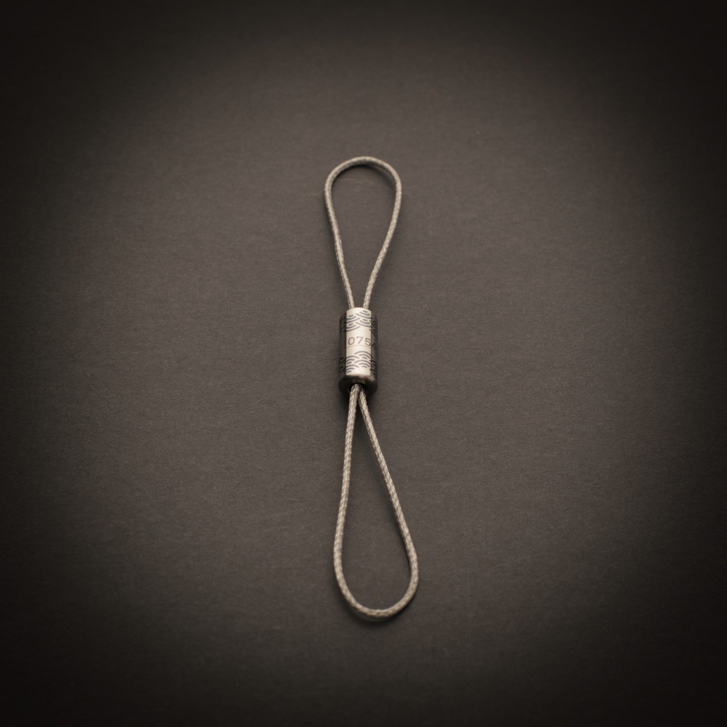 Personalised titanium Bow-Ti configured as a lightweight dual-loop tether