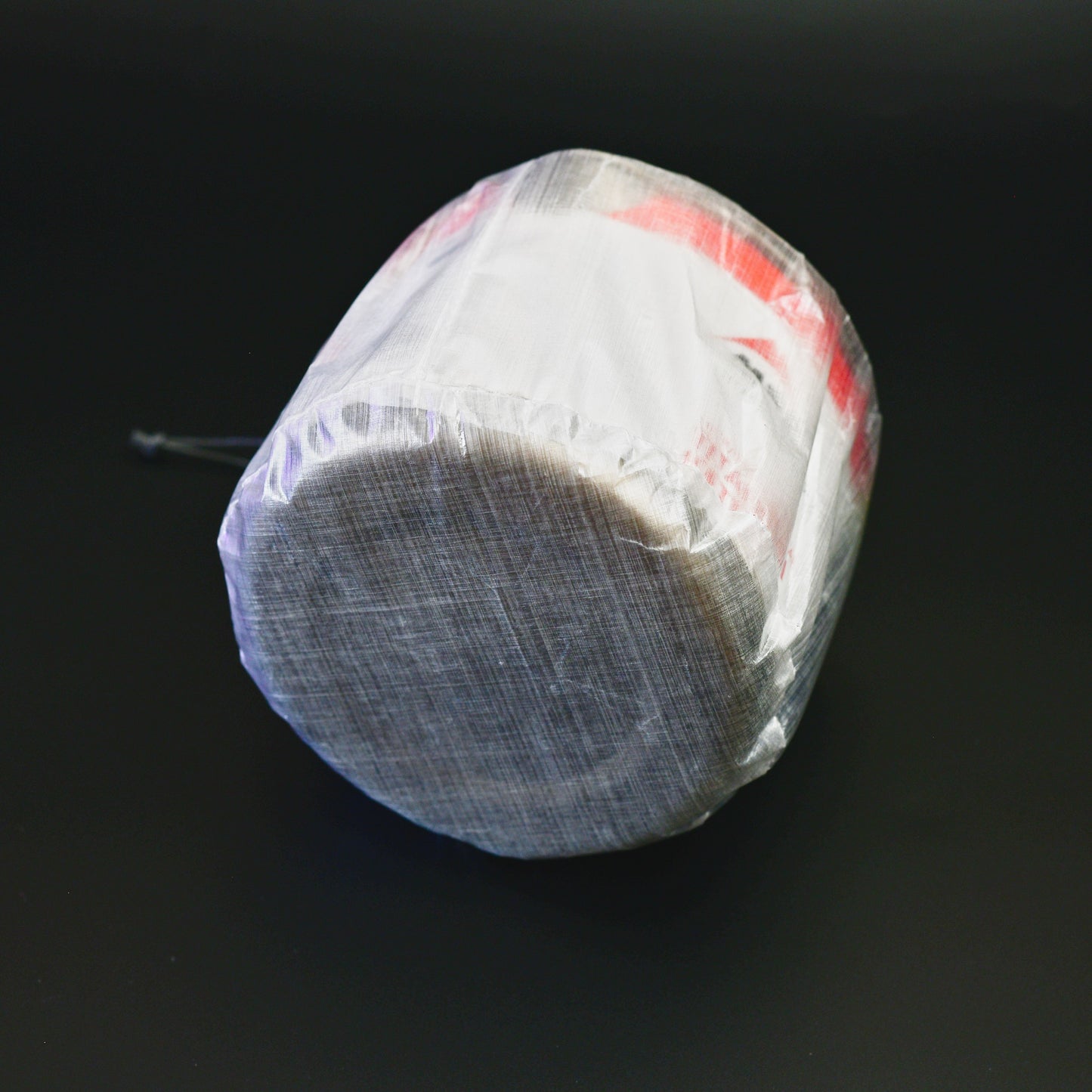 Base of a 4g Dyneema Composite Fabric stuff sack designed to fit the 2024 MSR Titan Kettle 900ml.