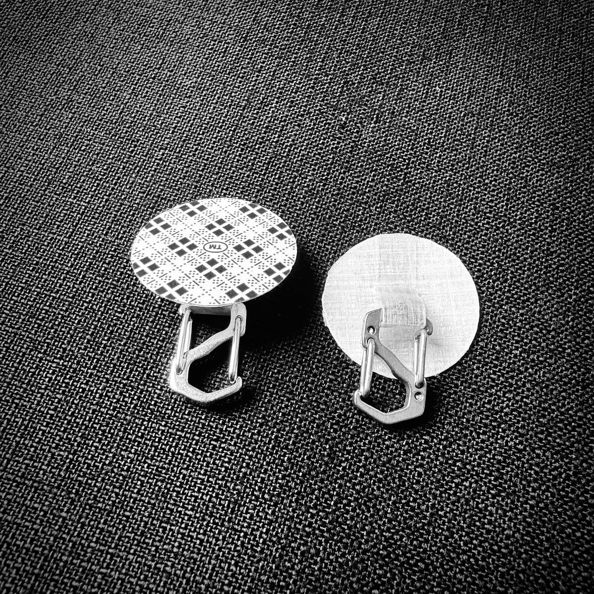 Two Microdot hanging points showing the adhesive backing and DCF loop with mini clips.