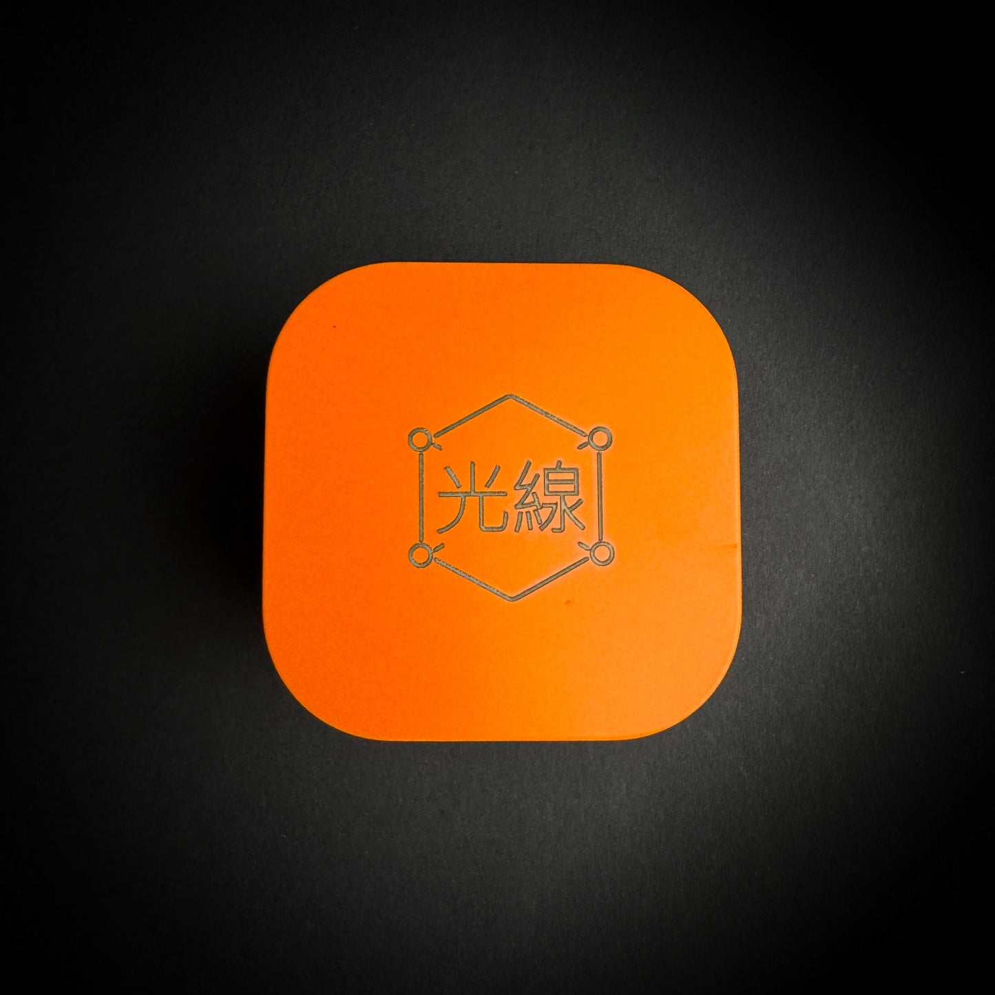 Kōsen Studio orange presentation tin with engraved logo for Journey Marker hat brim clip