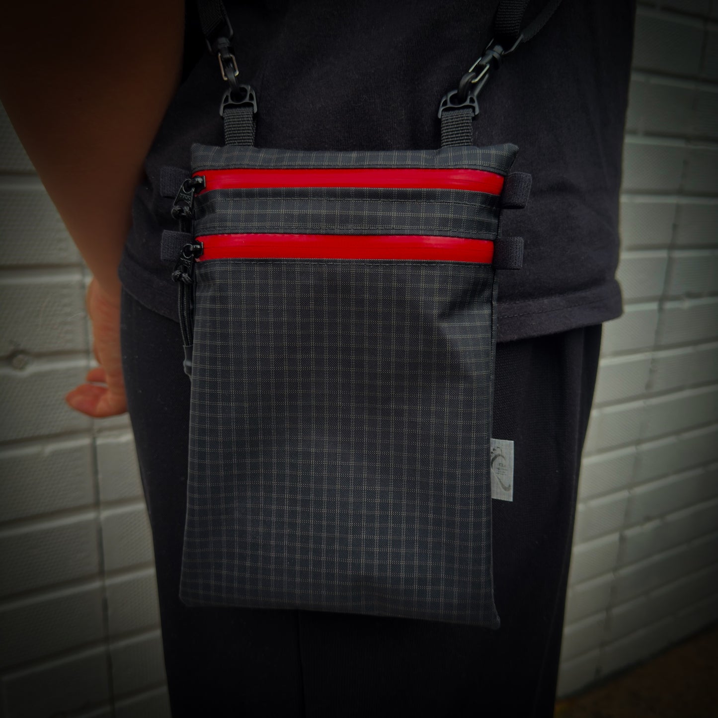 Ultralight Challenge UltraGrid twin zip shoulder bag with quick-release strap. Two YKK AquaGuard zip pockets for phone, wallet, passport and EDC gear.