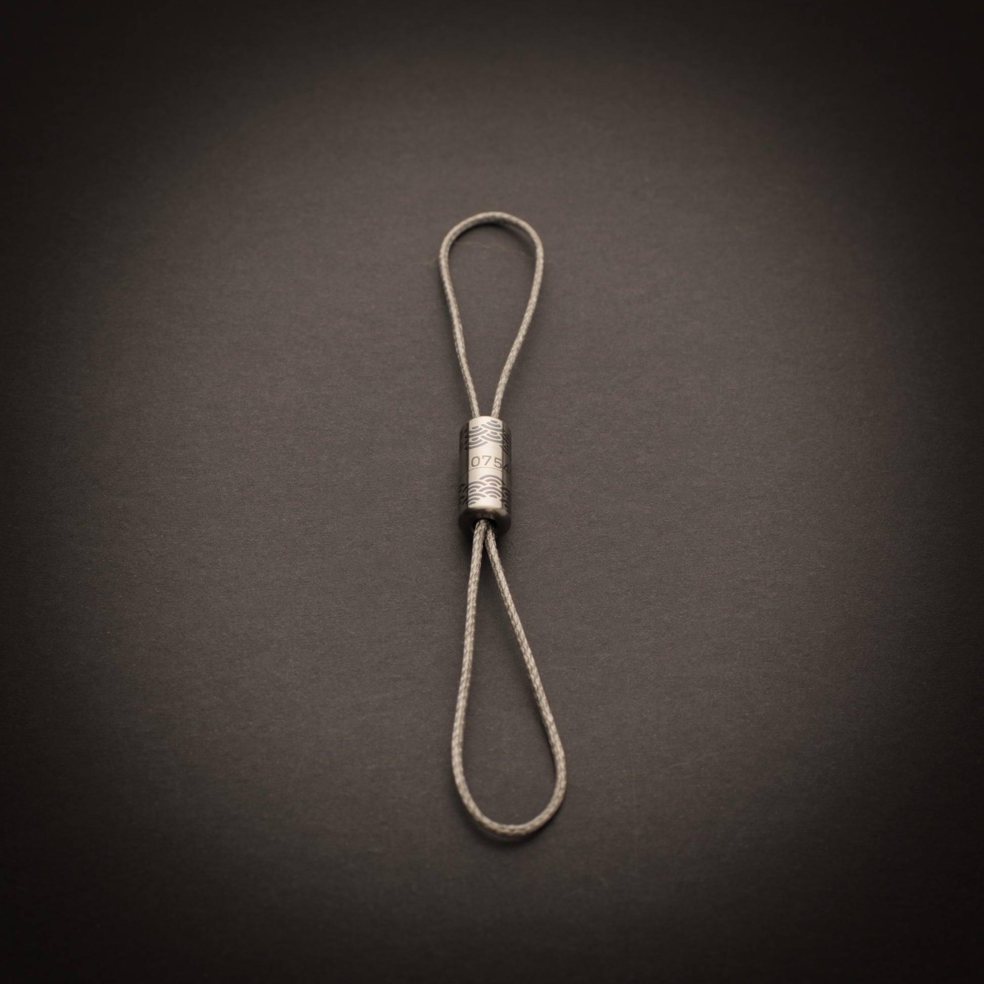 Personalised titanium Bow-Ti configured as a lightweight dual-loop tether