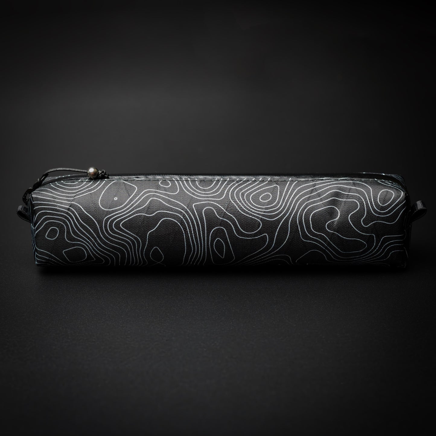 Topo Writing Instrument Case in VX15 X-Pac with topographic pattern, YKK AquaGuard zip and titanium bead pull.