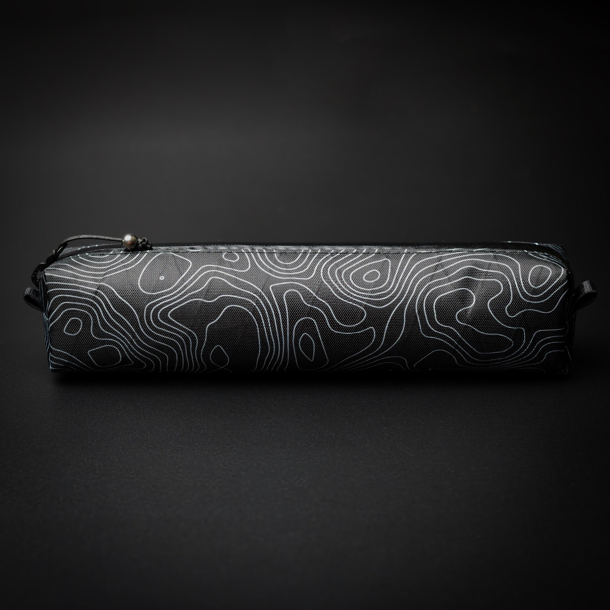 Topo Writing Instrument Case in VX15 X-Pac with topographic pattern, YKK AquaGuard zip and titanium bead pull.