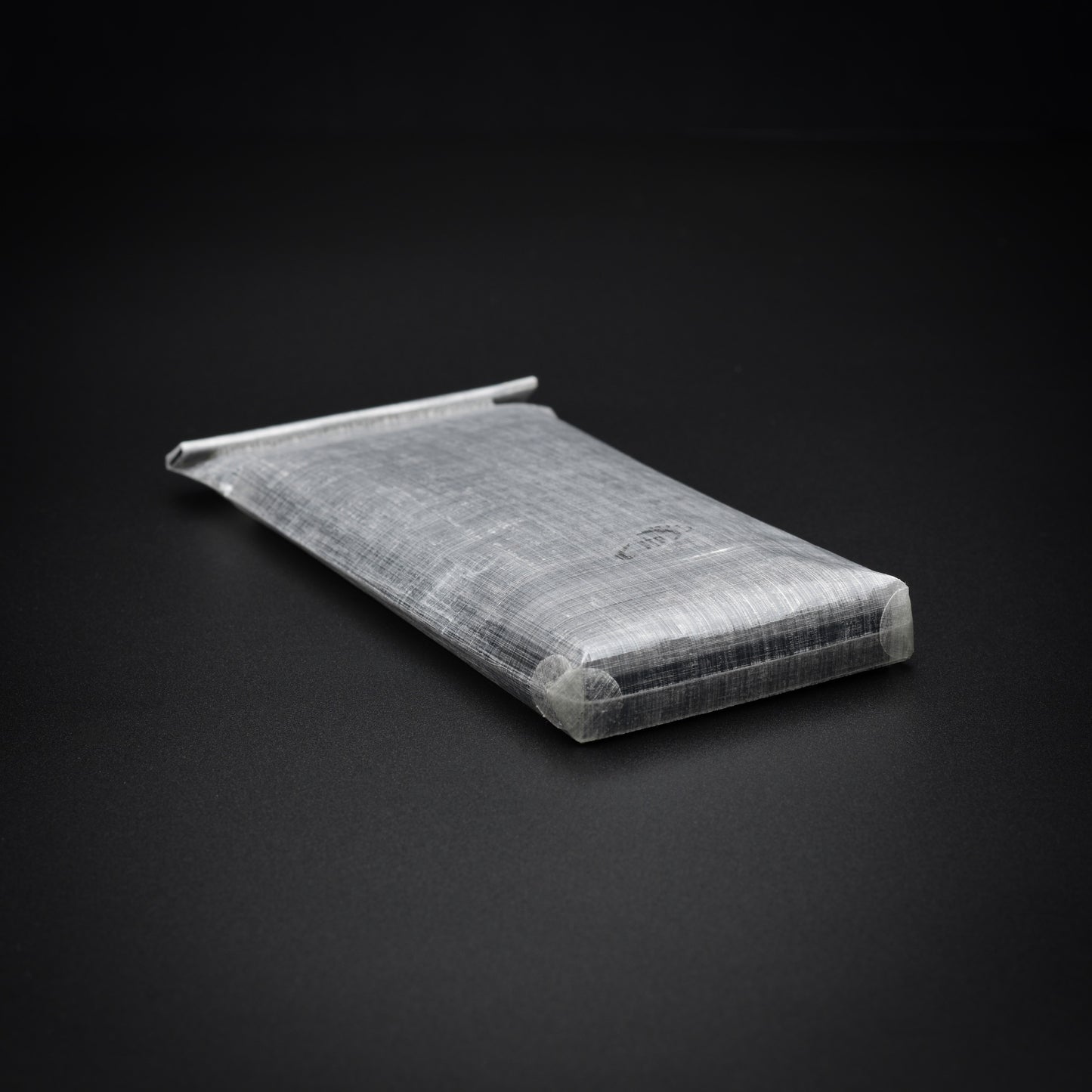 Transparent 1.43 oz Dyneema® Composite Fabric power bank dry bag with molded TreadTech™ roll-top closure and bonded corners.