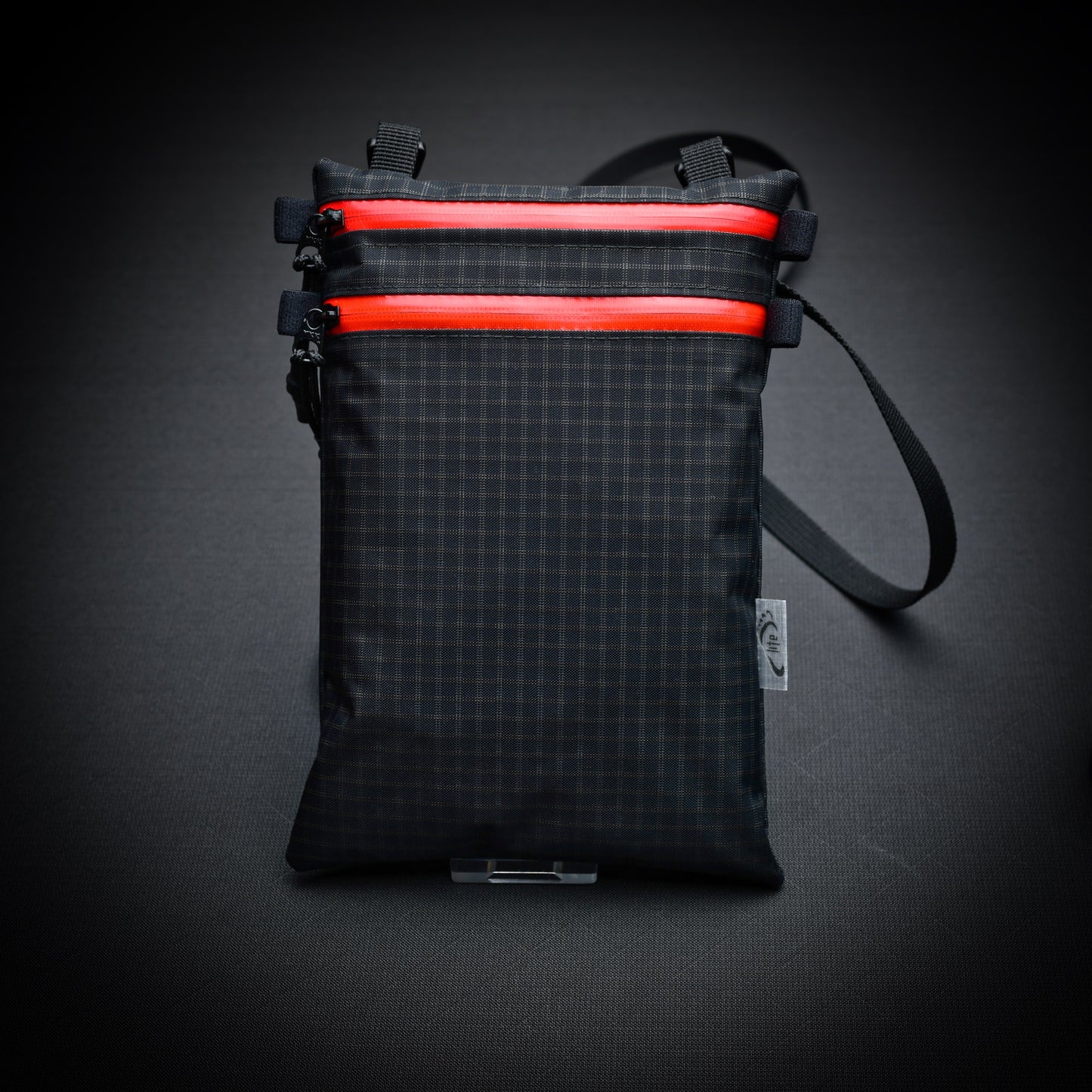 Ultralight Challenge UltraGrid twin zip shoulder bag with quick-release strap. Two YKK AquaGuard zip pockets for phone, wallet, passport and EDC gear.