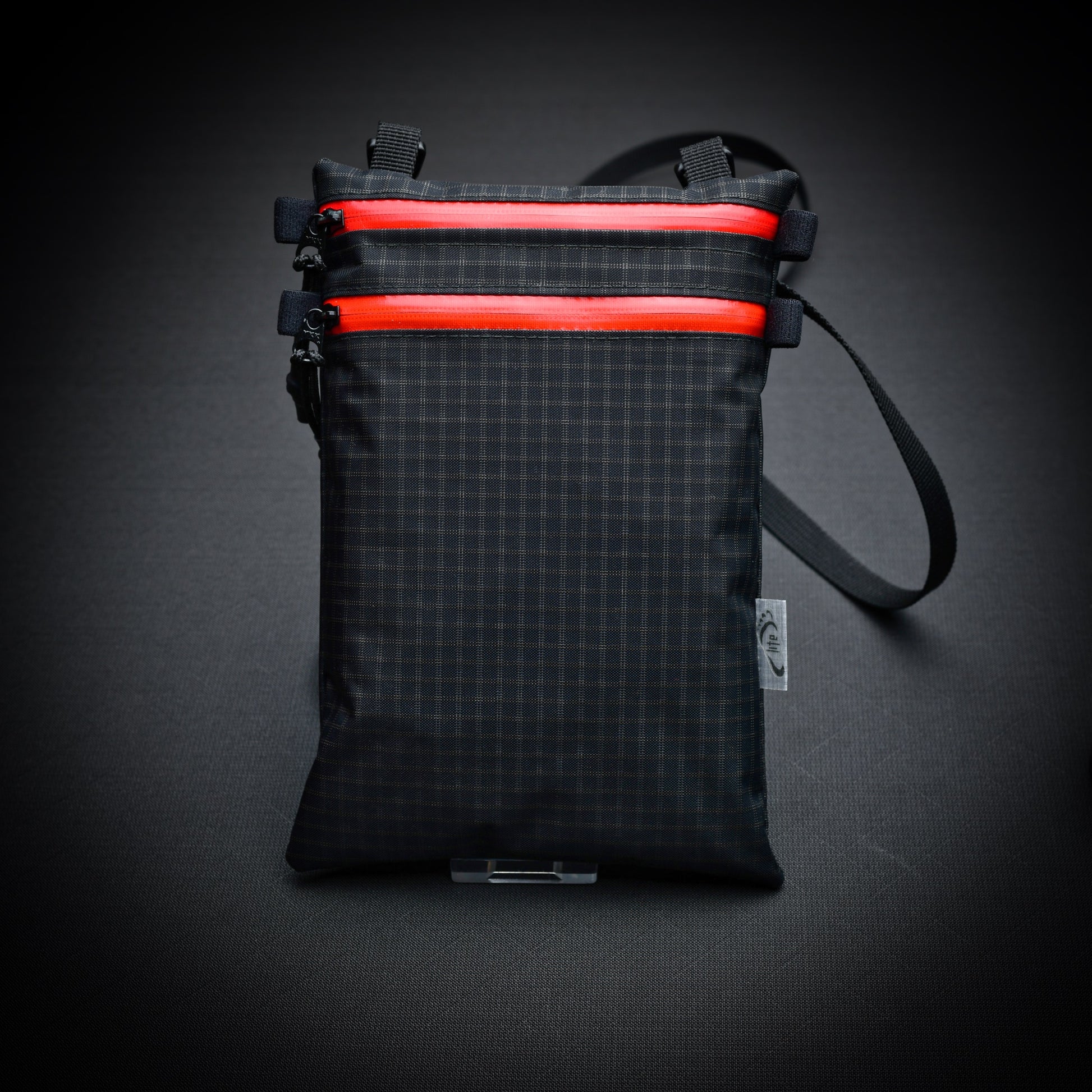 Ultralight Challenge UltraGrid twin zip shoulder bag with quick-release strap. Two YKK AquaGuard zip pockets for phone, wallet, passport and EDC gear.