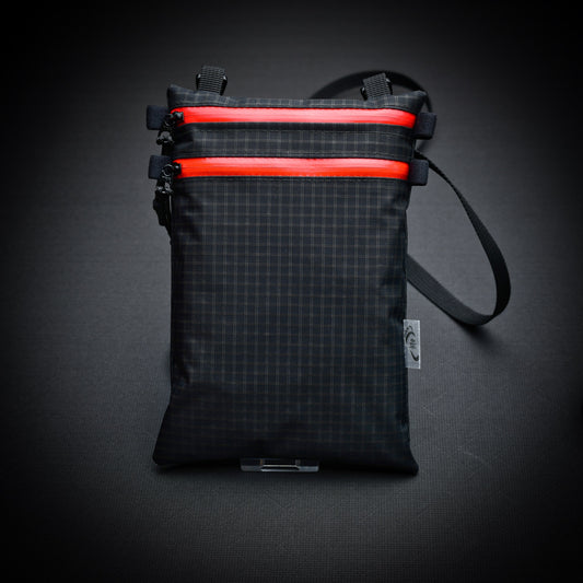 Ultralight Challenge UltraGrid twin zip shoulder bag with quick-release strap. Two YKK AquaGuard zip pockets for phone, wallet, passport and EDC gear.