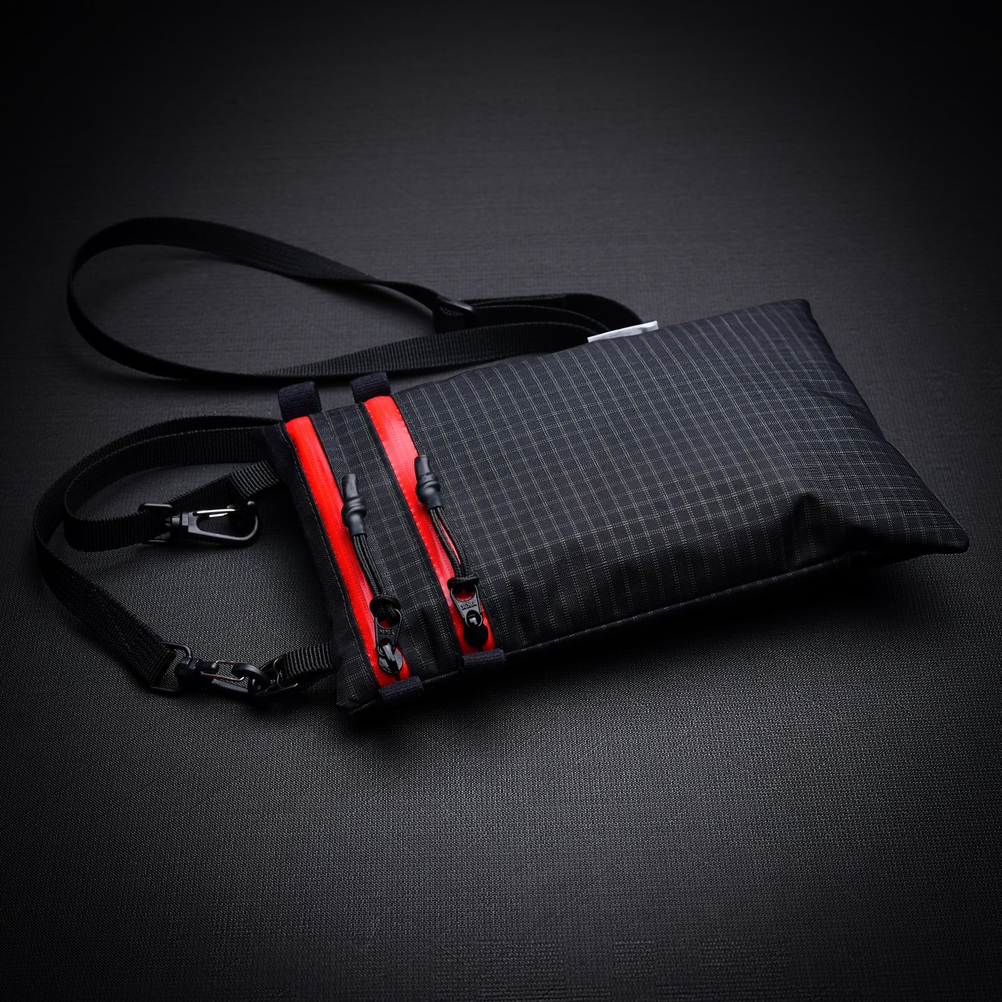 Ultralight Challenge UltraGrid twin zip shoulder bag with quick-release strap. Two YKK AquaGuard zip pockets for phone, wallet, passport and EDC gear.
