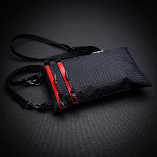 Ultralight Challenge UltraGrid twin zip shoulder bag with quick-release strap. Two YKK AquaGuard zip pockets for phone, wallet, passport and EDC gear.