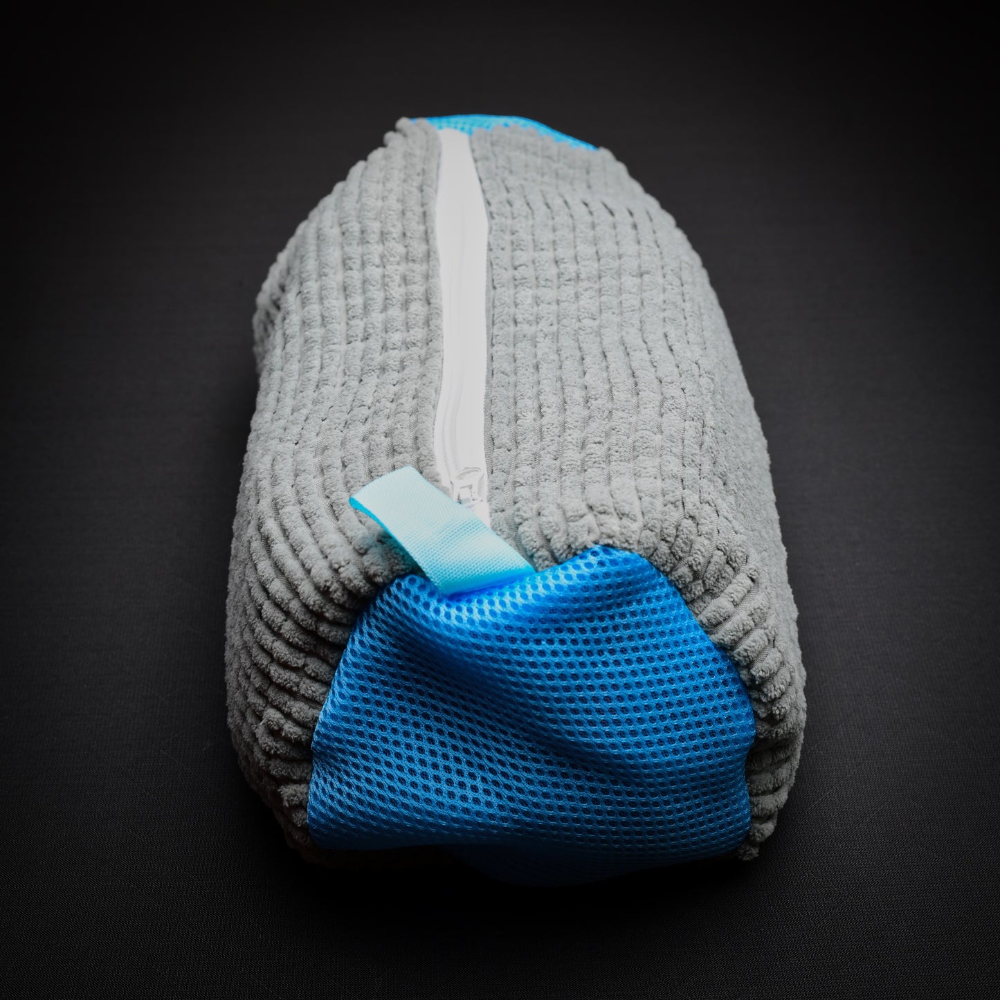 Grey microfibre trail shoe wash bag with breathable mesh end panel and full-length zip, designed for washing trail shoes.