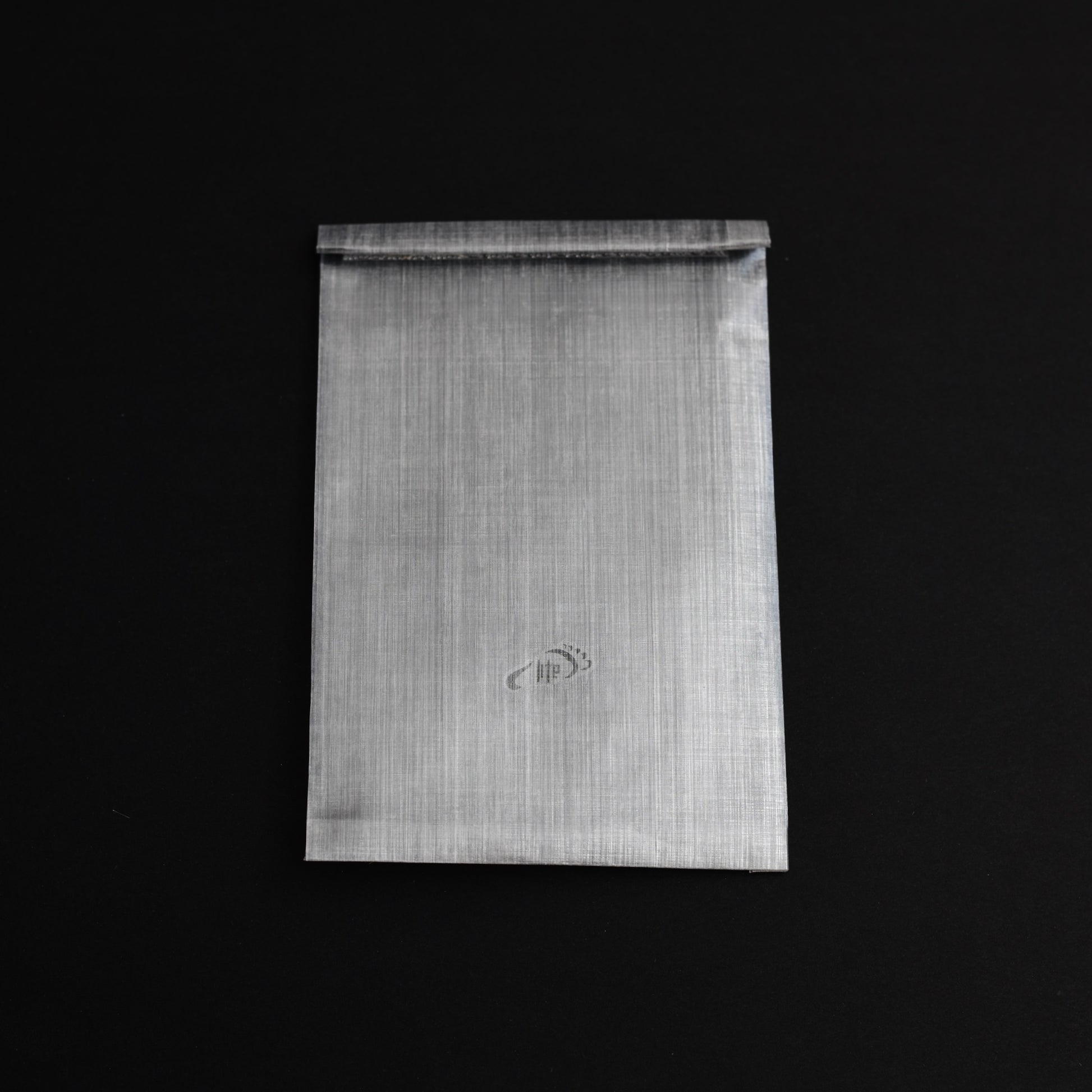 Lightweight bonded Dyneema Composite Fabric roll-top passport sleeve, offering highly water-resistant travel protection.