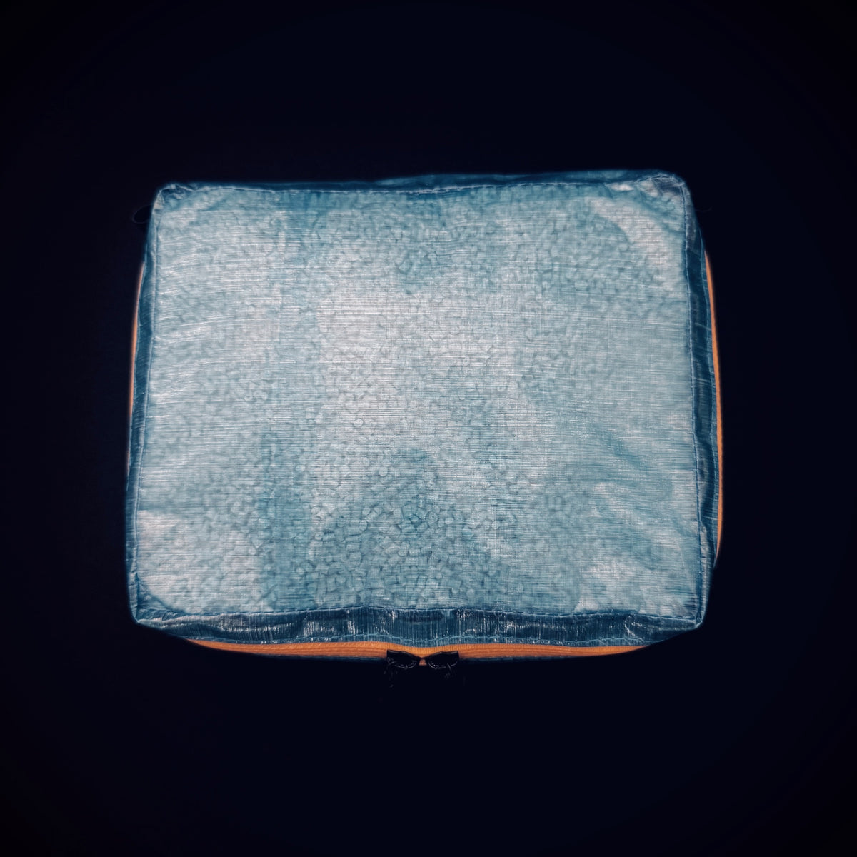 Top view of blue 1.43 oz DCF Mini Packing Cell showing its rectangular shape and lightweight translucent construction