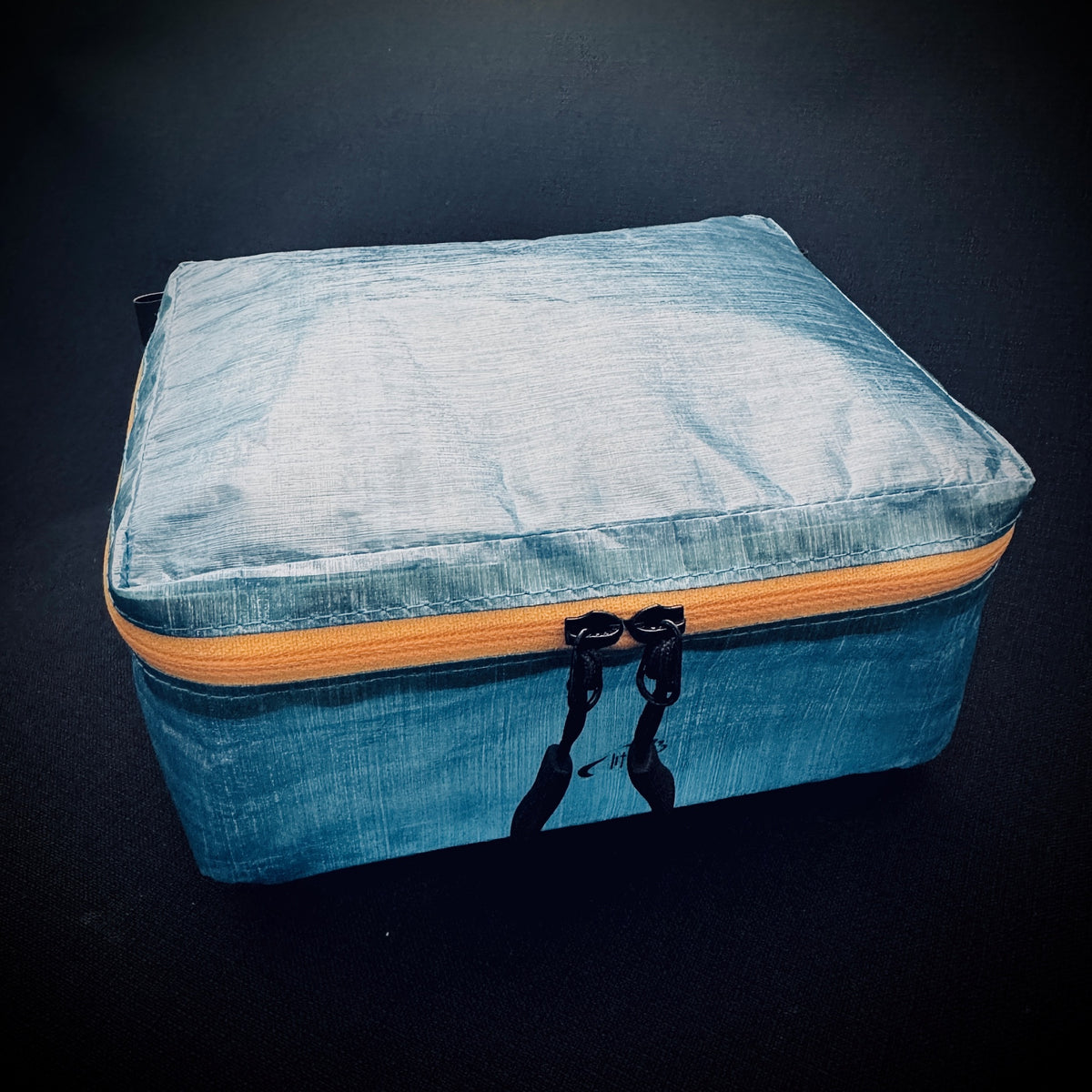 Blue Dyneema® Mini Packing Cell with contrasting yellow YKK AquaGuard zip, twin zip pulls and box-shaped construction.