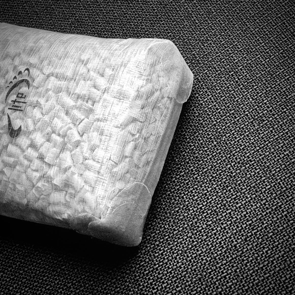Close-up of the bonded corners and three-dimensional base of the DCF battery dry bag.