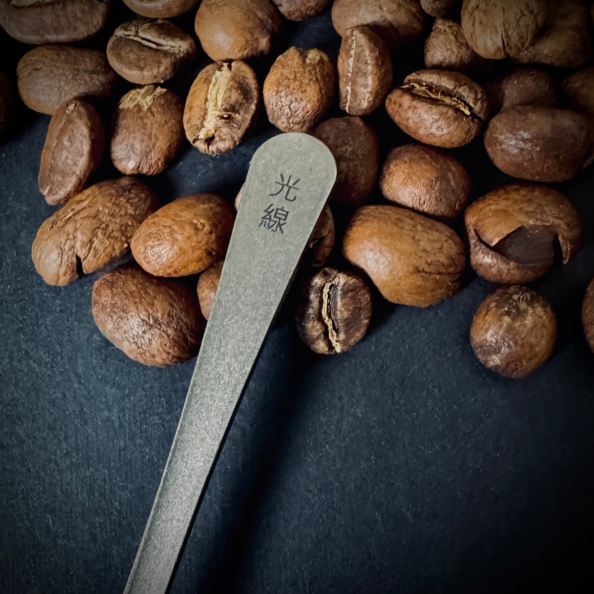 Reverse of Grade 5 titanium coffee spoon showing the small Kōsen maker’s mark.
