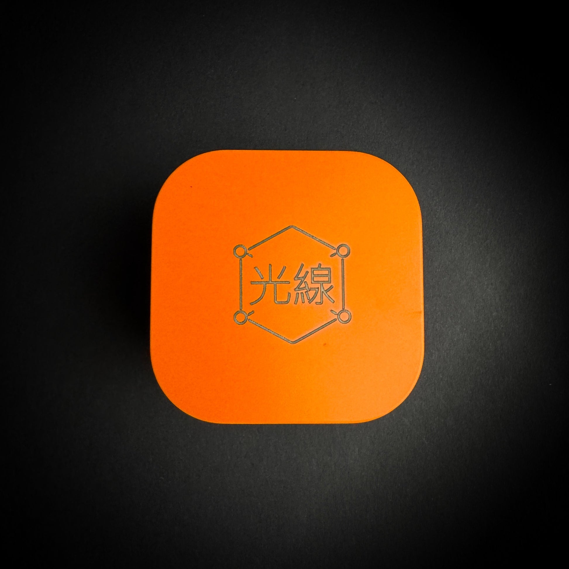 Kōsen Studio orange presentation tin with engraved logo for Journey Marker hat brim clip
