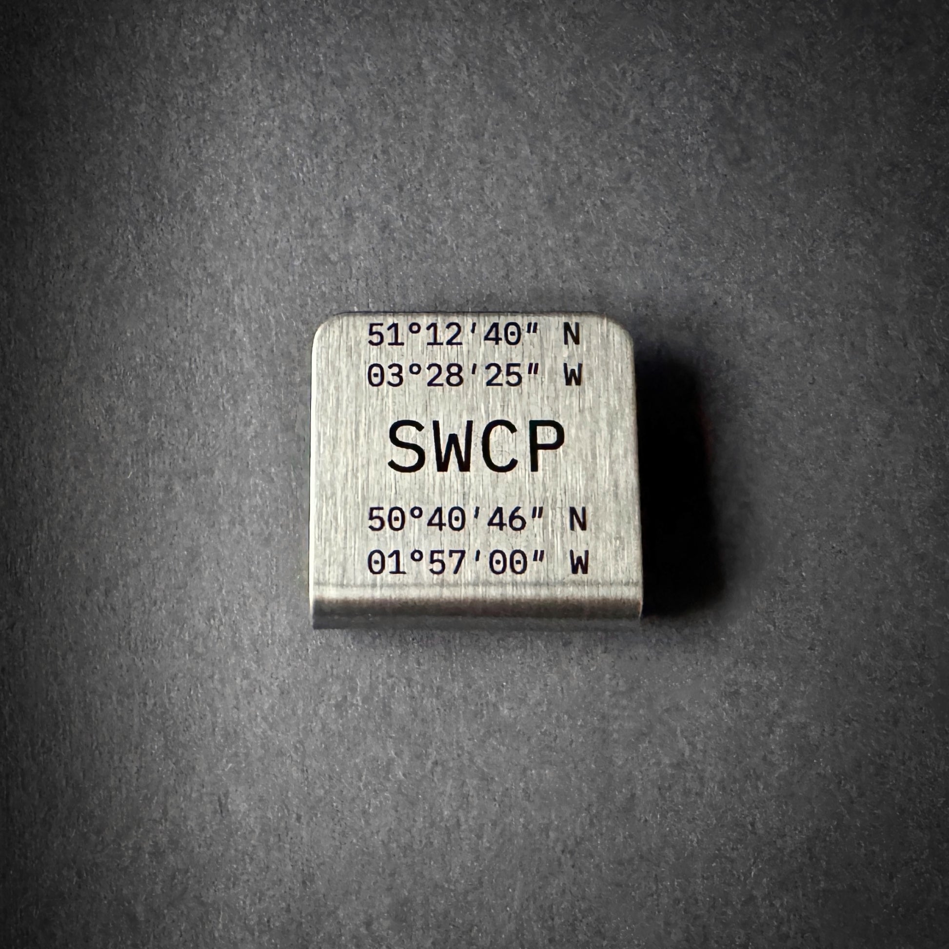 South West Coast Path stainless steel journey marker hat clip engraved with trail coordinates