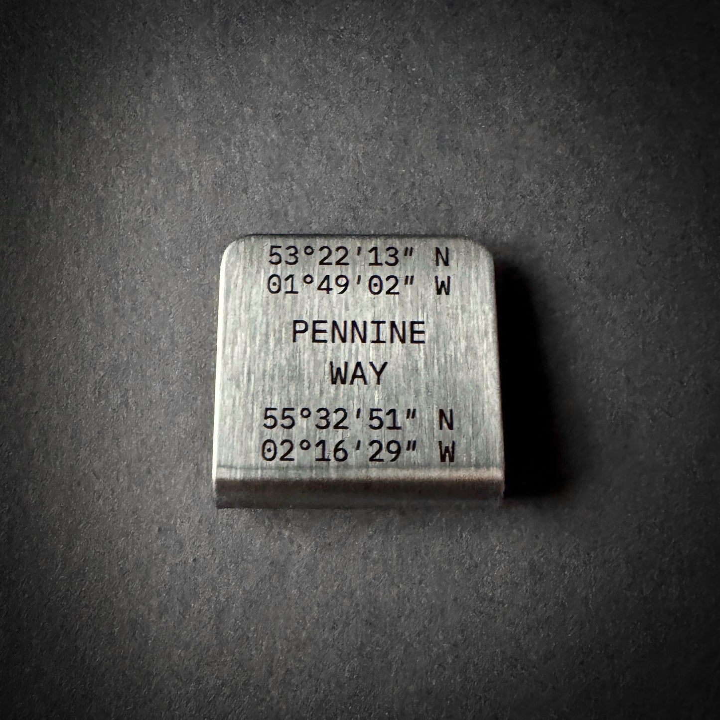 Pennine Way stainless steel journey marker clip engraved with start and finish coordinates